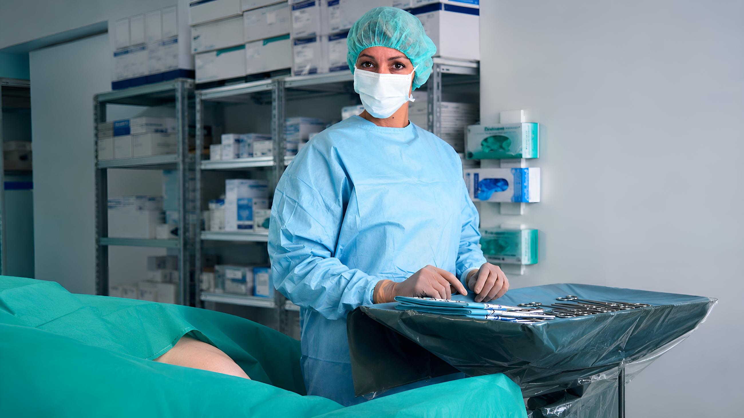 Mistress surgeon preparing tools in MedFet clinic Belgium